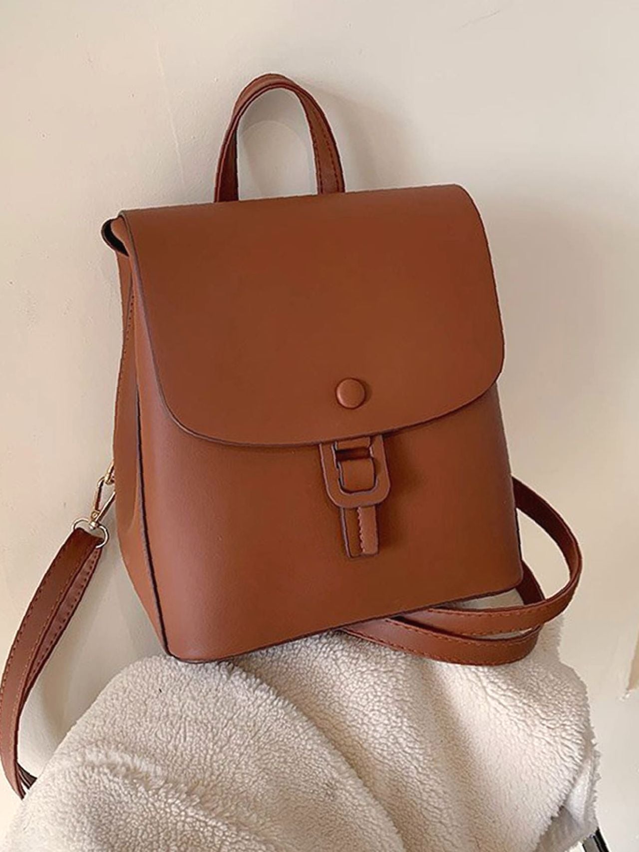 Brown buckle-detail flap backpack